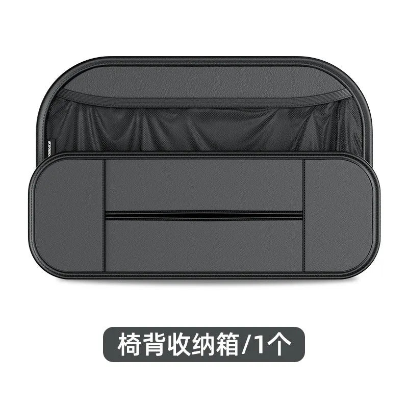 Black leather storage bag attached to the back of a car seat for organisation.