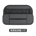 Black leather storage bag attached to the back of a car seat for organisation.