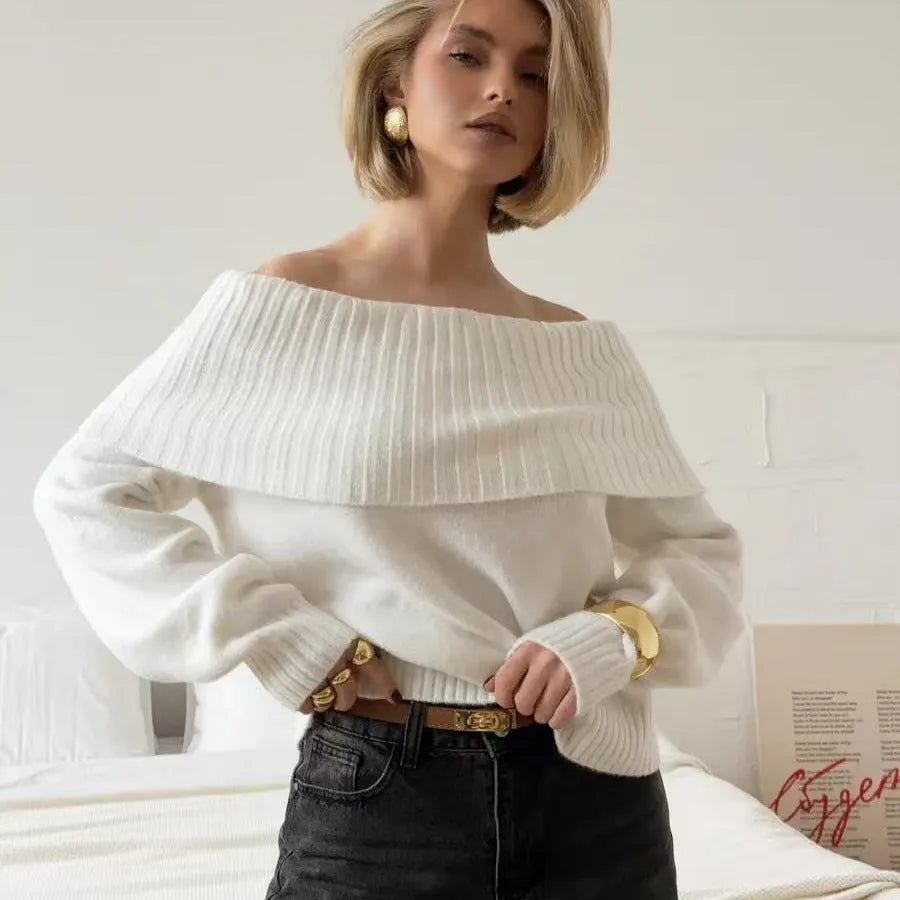 Grey off-the-shoulder strapless sweater with a raised 3D pattern texture.