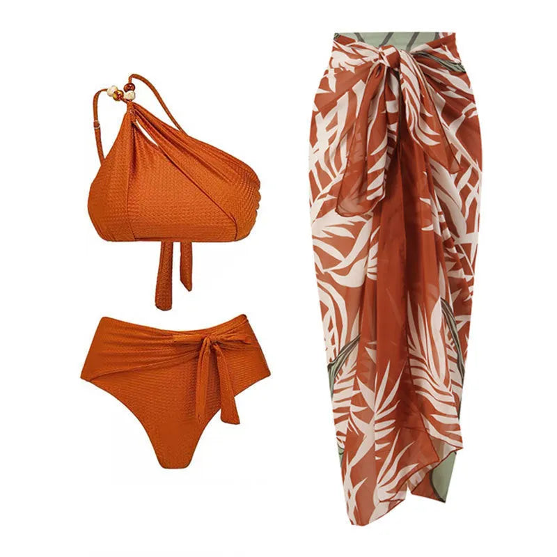 Women's brown push up bikini with high waist briefs and a matching sheer chiffon dress overlay.