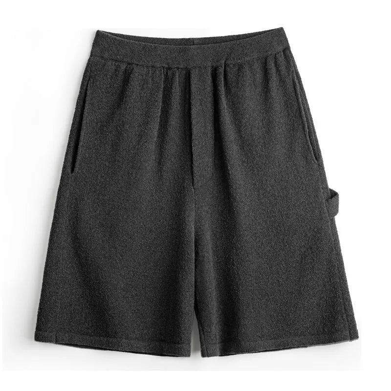 American-style heavy grey straight-leg sports shorts with elastic waistband on a solid background