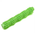 Green durable rubber dog chew toy with textured ridges and a hollow treat-dispensing centre.
