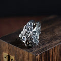 Sterling silver open ring with a detailed domineering jibeast animal and zodiac pattern.