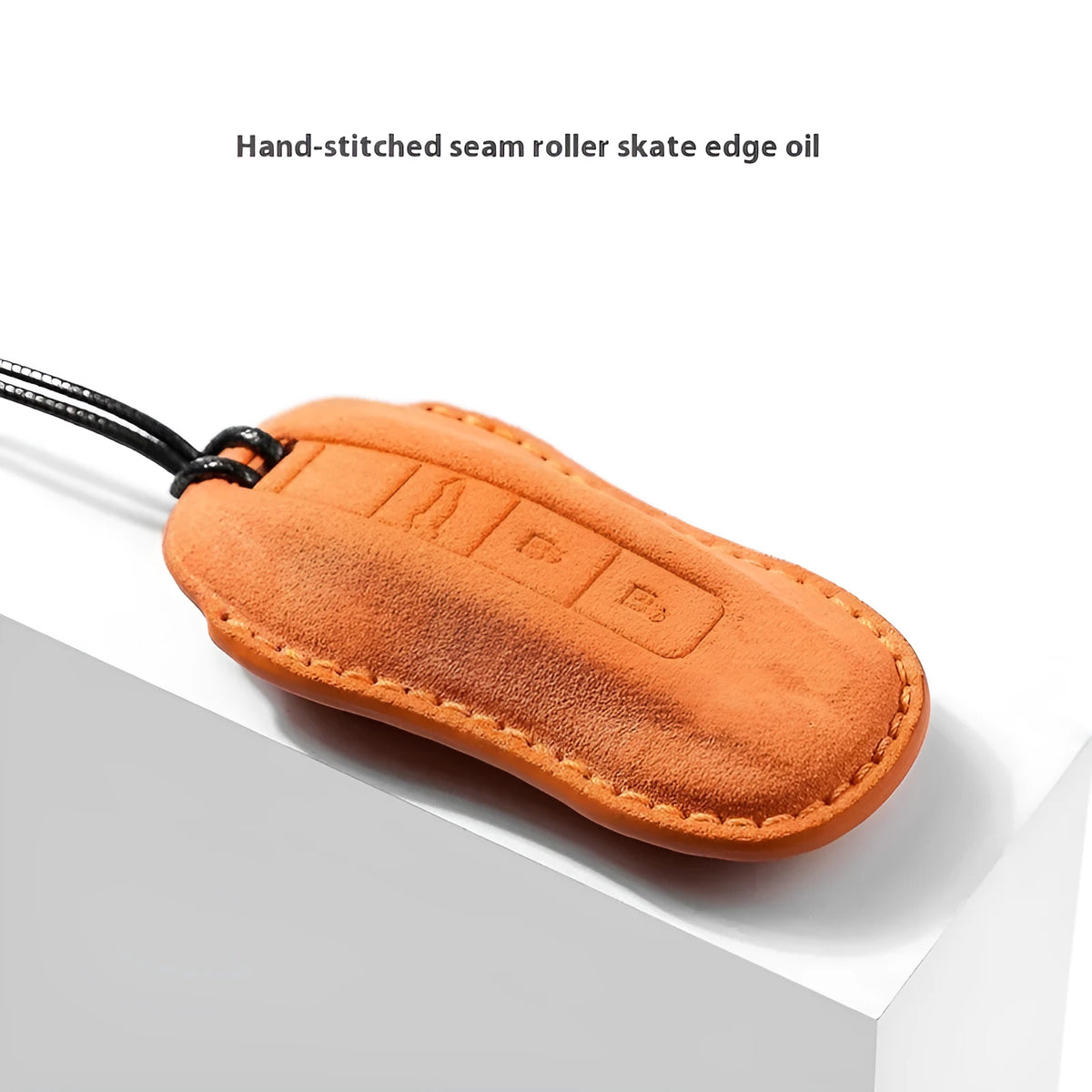 Suede car key cover protector shown in cement grey, dark green, light grey, and orange colours.