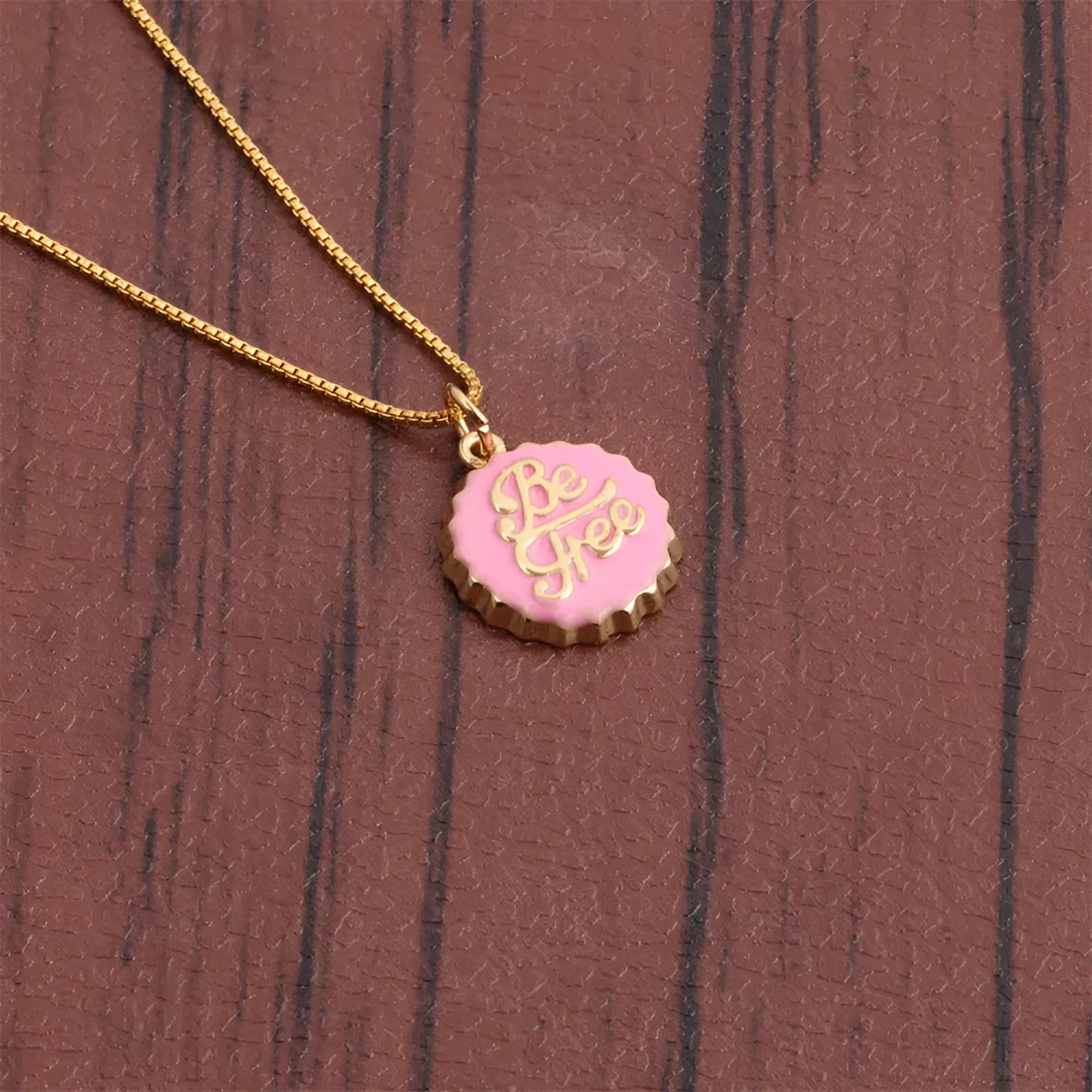 Copper bottle cap pendant necklace on a 40cm box chain with 18K gold electroplating.