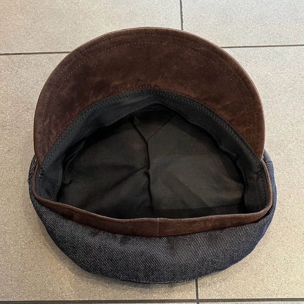 Dark blue denim newsboy hat with octagonal crown and contrasting brim