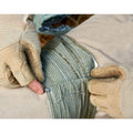 Packaged roll of tactical hemostatic gauze bandage showing 10cm and 15cm size options.