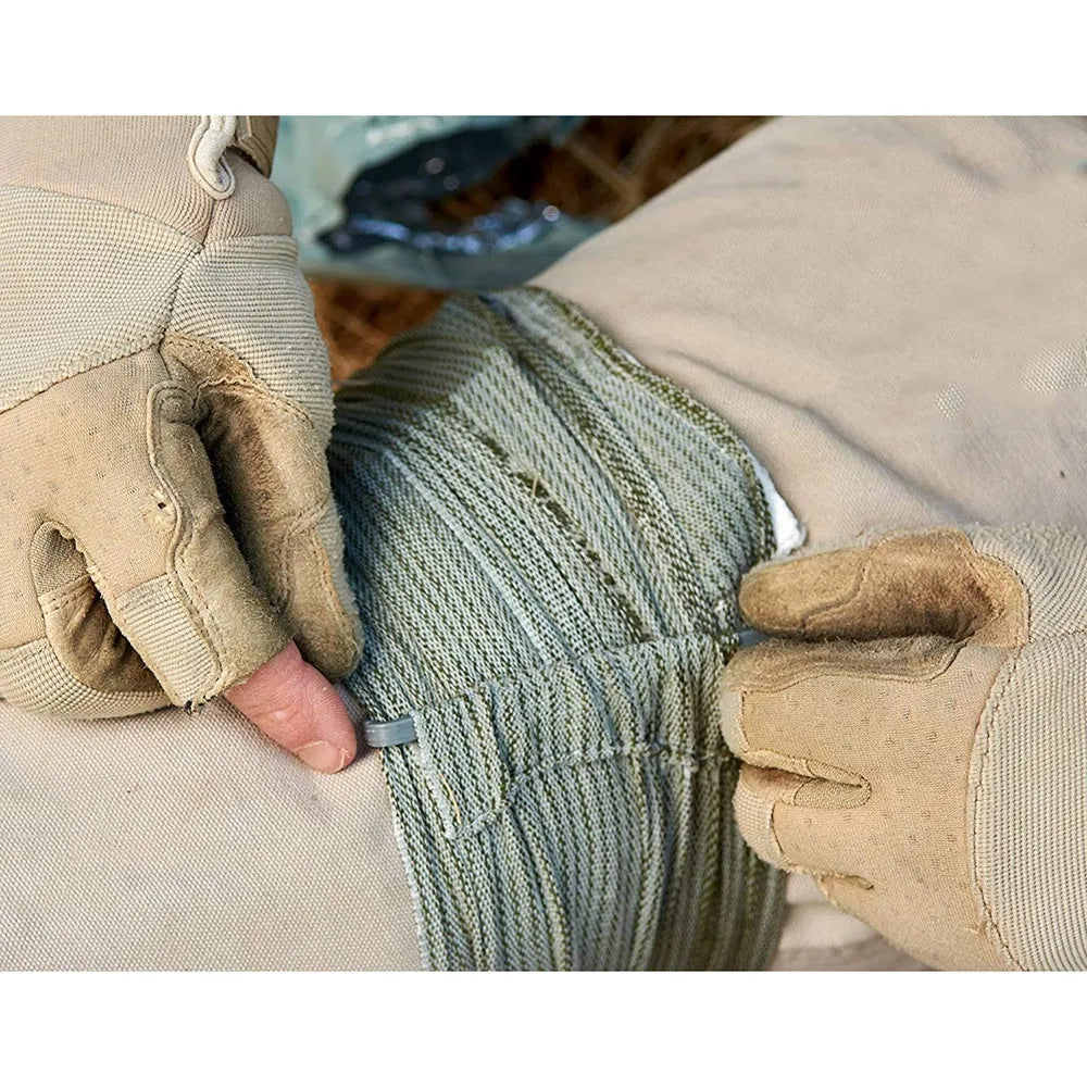 Packaged roll of tactical hemostatic gauze bandage showing 10cm and 15cm size options.