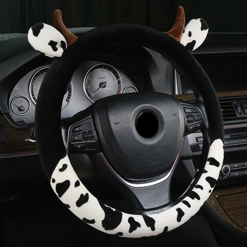 Short plush automotive steering wheel cover in black colour with protective handle design