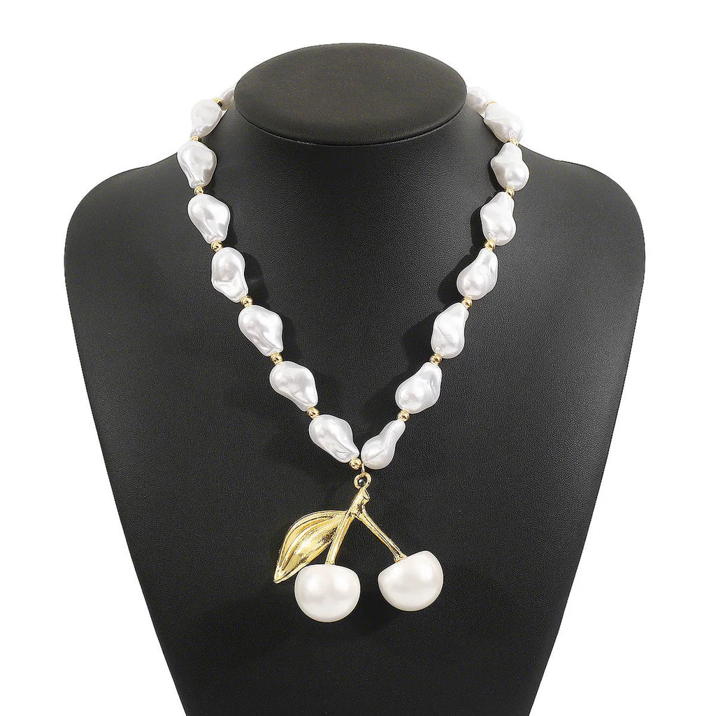 Women's creative pearl necklace with geometric fruit pendant in gold or white finish options