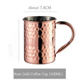 Stainless steel Moscow Mule cup with glass liner in rose gold hammered finish.