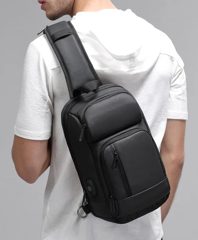 Black PVC outdoor leisure shoulder bag with air cushion strap and internal organiser pockets