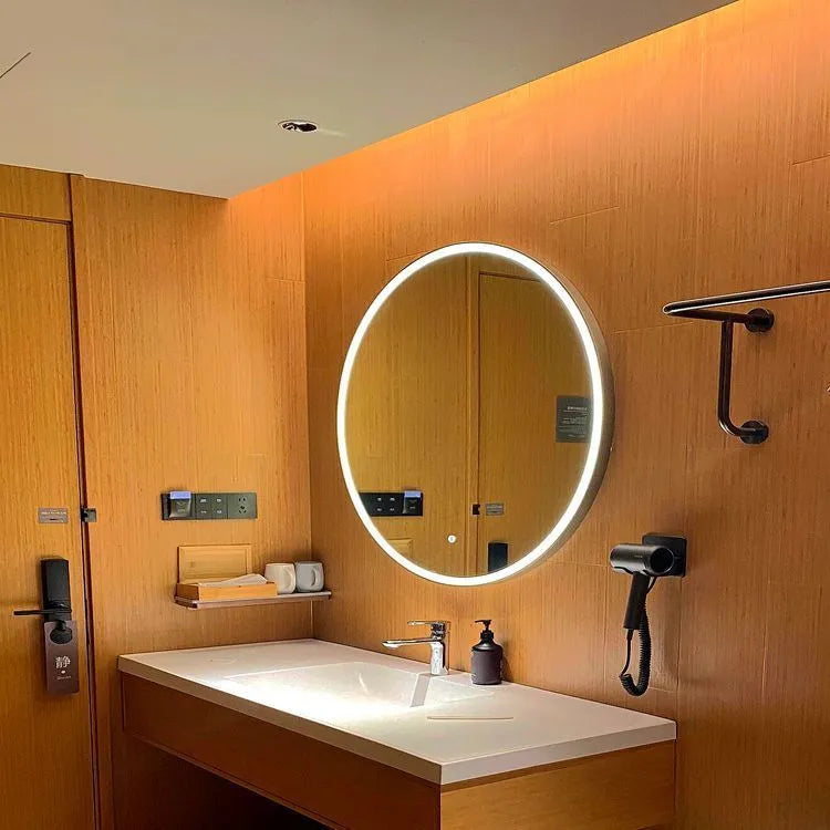Round black aluminium frame wall mirror with integrated LED lighting around the edge.