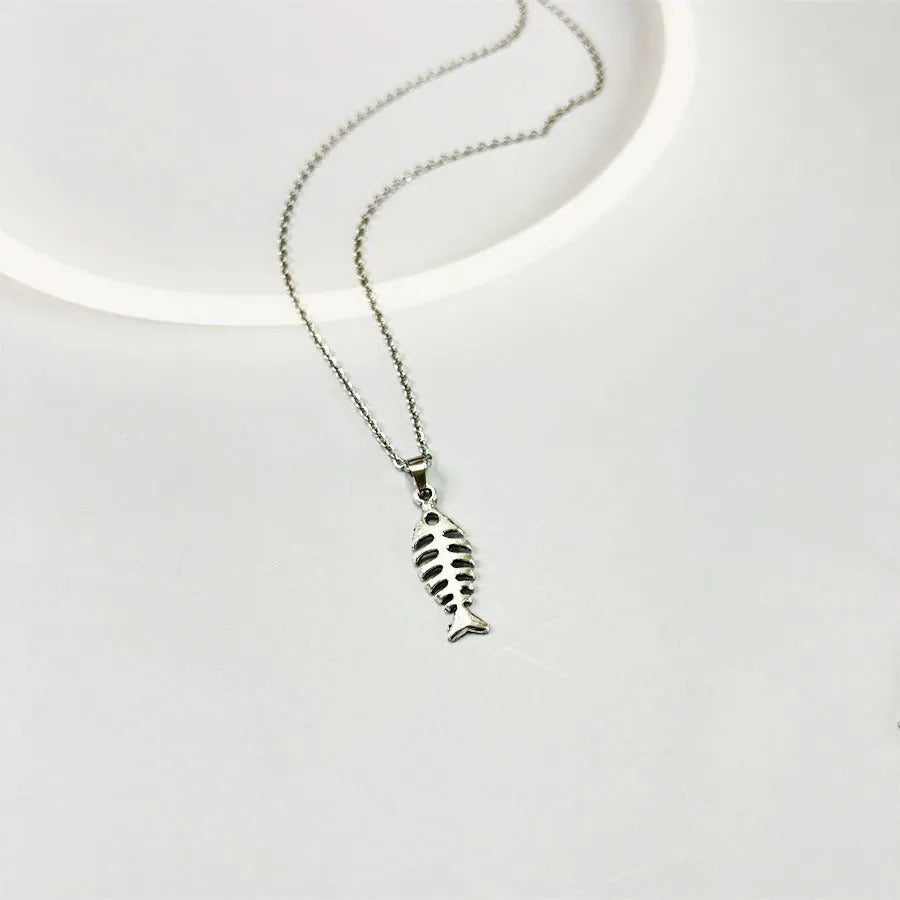 Women's retro-style alloy fishbone pendant necklace and matching earrings set on a white background