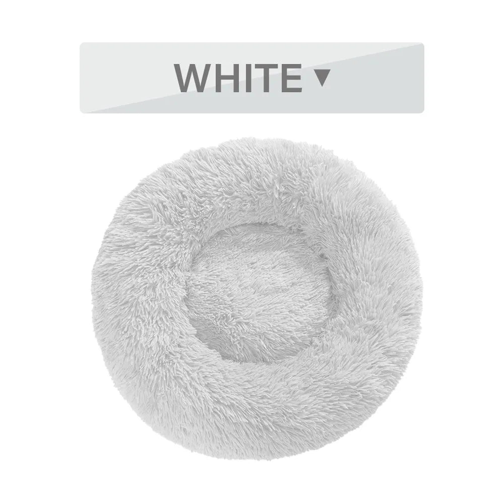 Fluffy donut-shaped pet bed in long plush fabric, shown in a grey colour