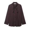 Brown women's long sleeve poplin shirt with a bow tie, shown in a loose cardigan style.