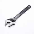 Blackened high carbon steel adjustable open-end wrench showing adjustable jaw mechanism and ergonomic handle