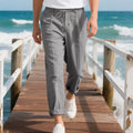 Men's straight-leg linen casual trousers in light khaki colour with a drawstring waist.