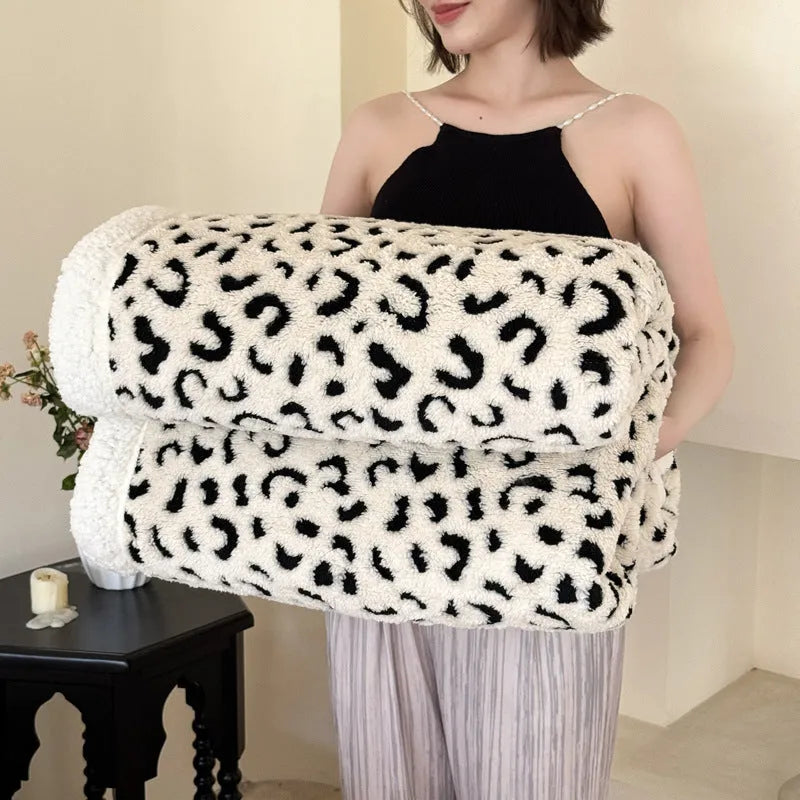 Double-layer taffeta blanket with reversible leopard jacquard print design shown in camel colour