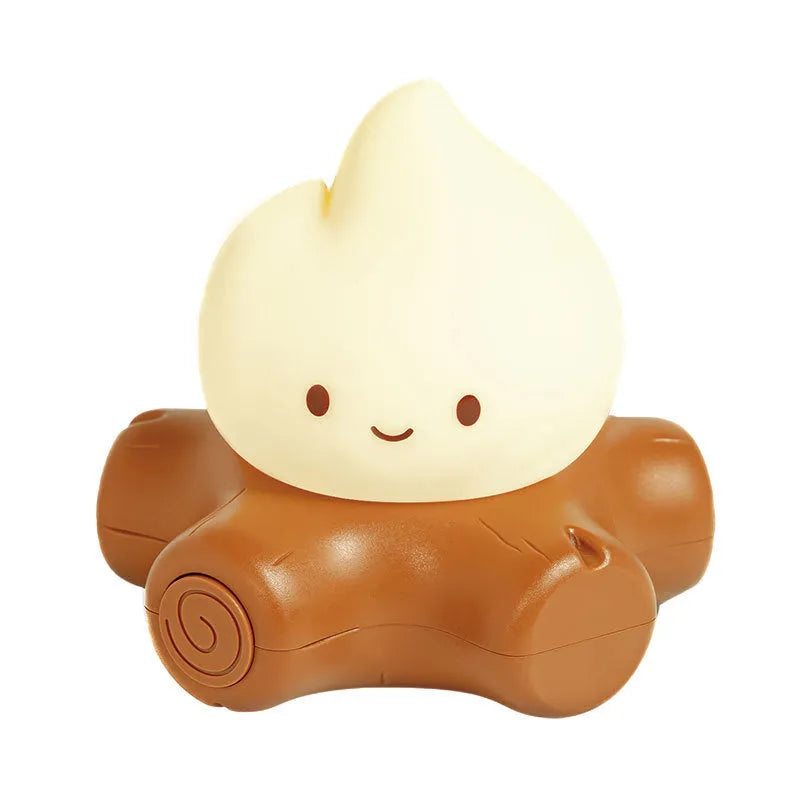 Silicone small fire pile cartoon night lamp with ABS shade on a surface