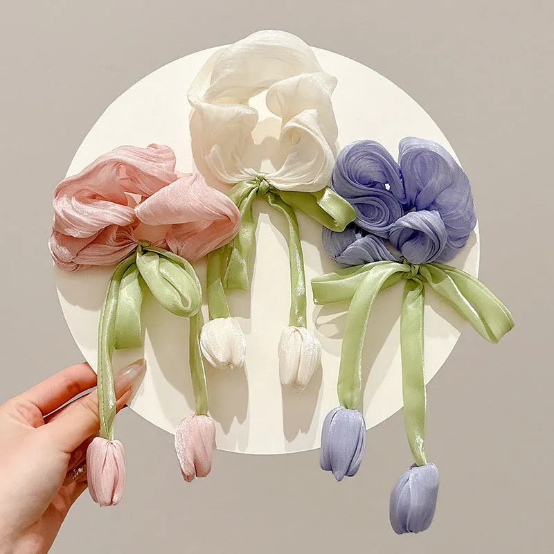 Children's knitted fabric headband with tulip element in Korean style, shown in beige, pink or purple colour option