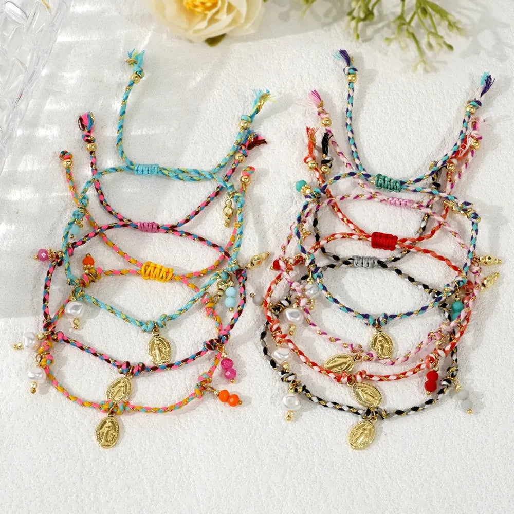 Close-up of a colourful hand-woven braided rope bracelet for women with an adjustable fabric strap tag.
