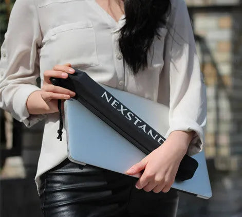 Black folding portable laptop stand showing reinforced nylon construction and compact folded dimensions