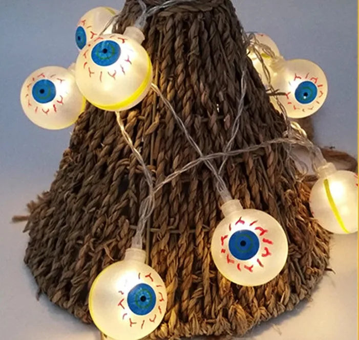 Halloween decoration LED string lights with 10 LED heads including pumpkin, bat, and ghost pendants on a dark background
