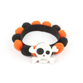 Halloween pet fur ball collar with pumpkin decoration in orange and black festive designs.