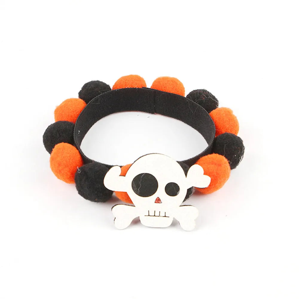Halloween pet fur ball collar with pumpkin decoration in orange and black festive designs.