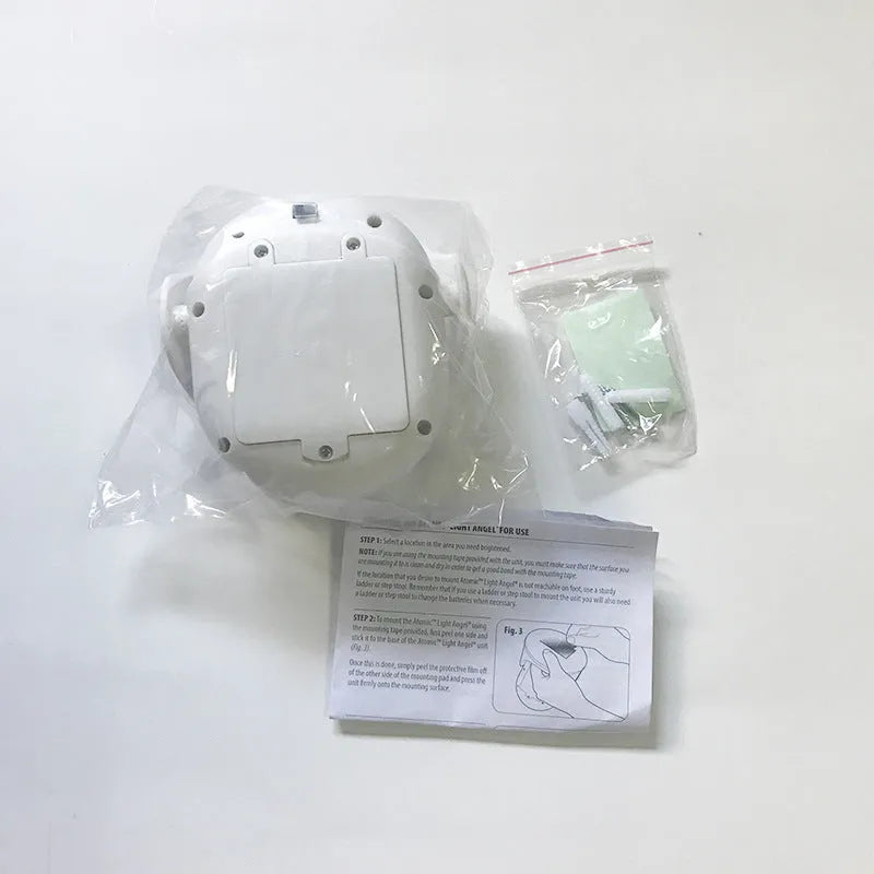 White atomic angel induction light with ABS plastic housing measuring 13.3cm by 9.8cm by 15.8cm