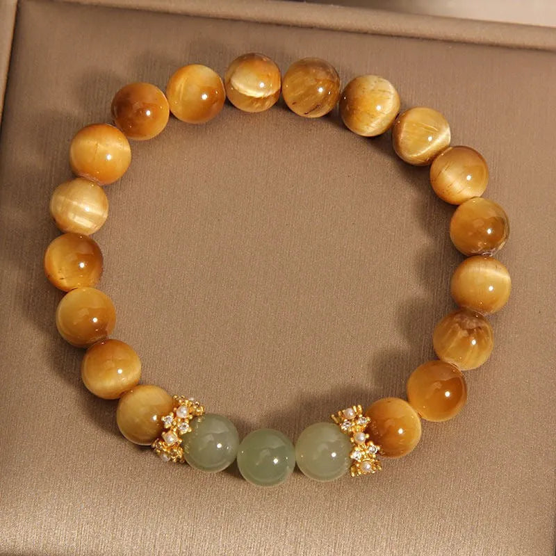 Natural yellow Tiger's Eye Hetian Jade bracelet with U-shaped design and auspicious patterns