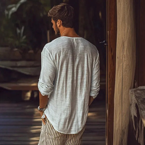 Beige slim-fit long-sleeved V-neck t-shirt laid flat, showing its hemp-blend fabric texture.
