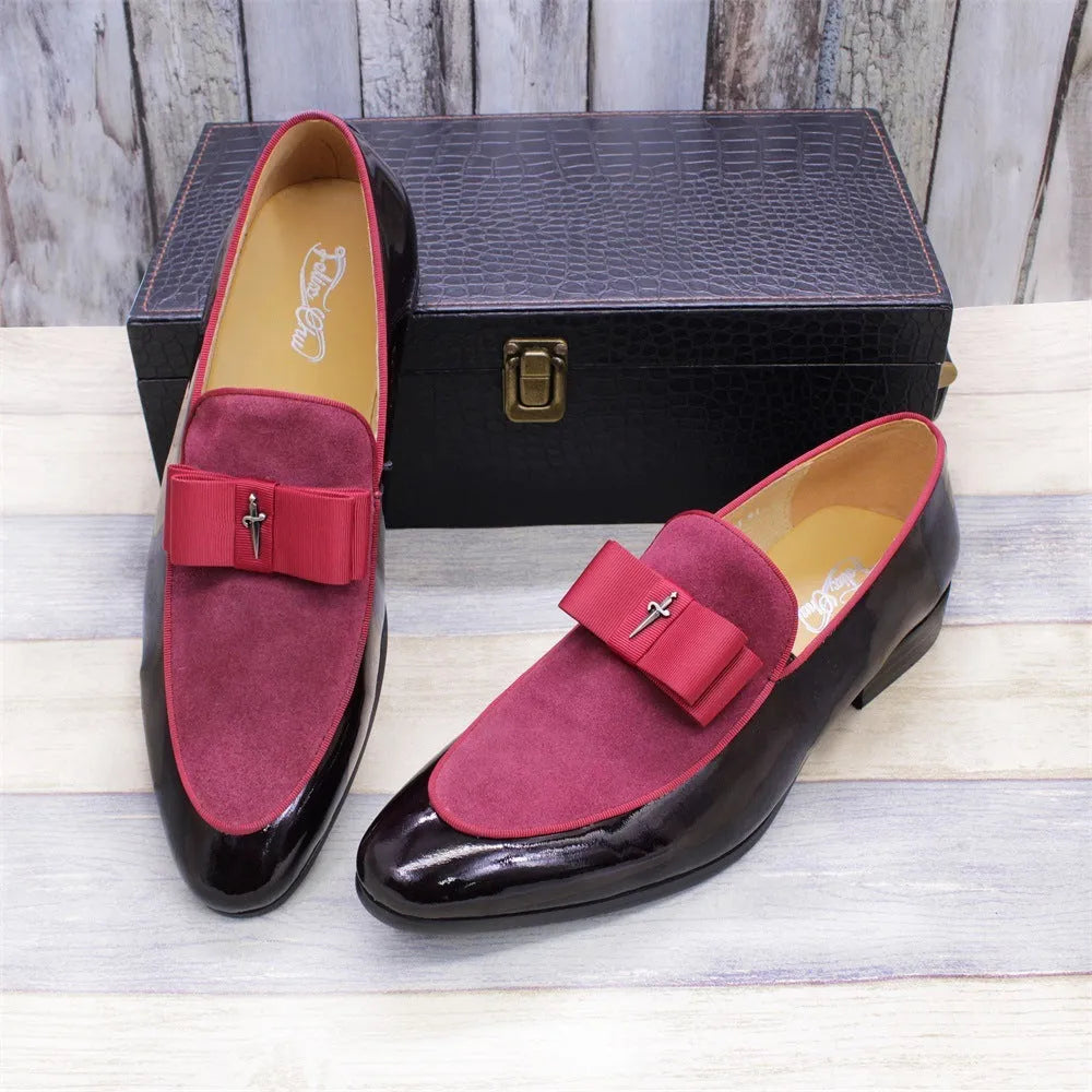 Men's black leather shoes with patent leather finish and a decorative tassel on the front.