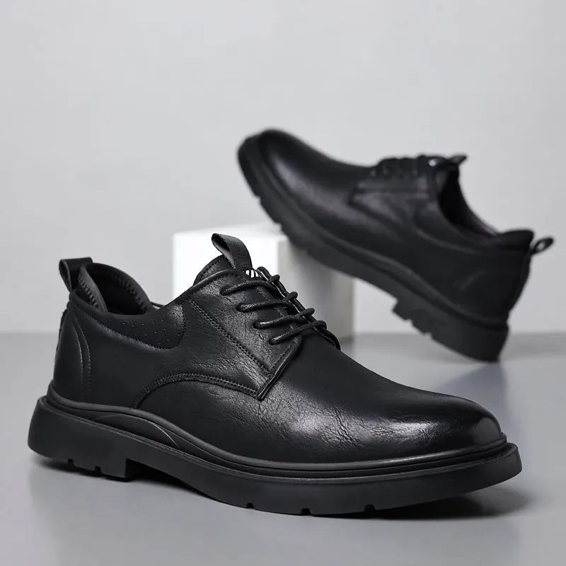 Men's black and brown leather shoes with sewn detailing and rubber sole