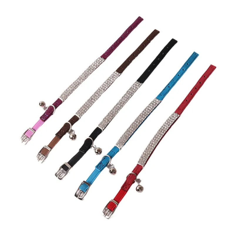 Soft flocking elastic buckle cat collar in multiple colours on a white background.