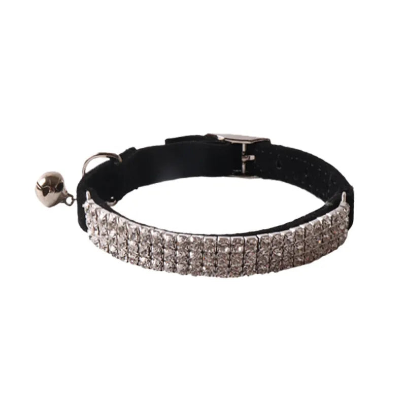 Soft flocking elastic buckle cat collar in multiple colours on a white background.