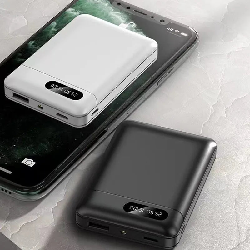 Black and white portable power bank showing compact rectangular design with USB ports