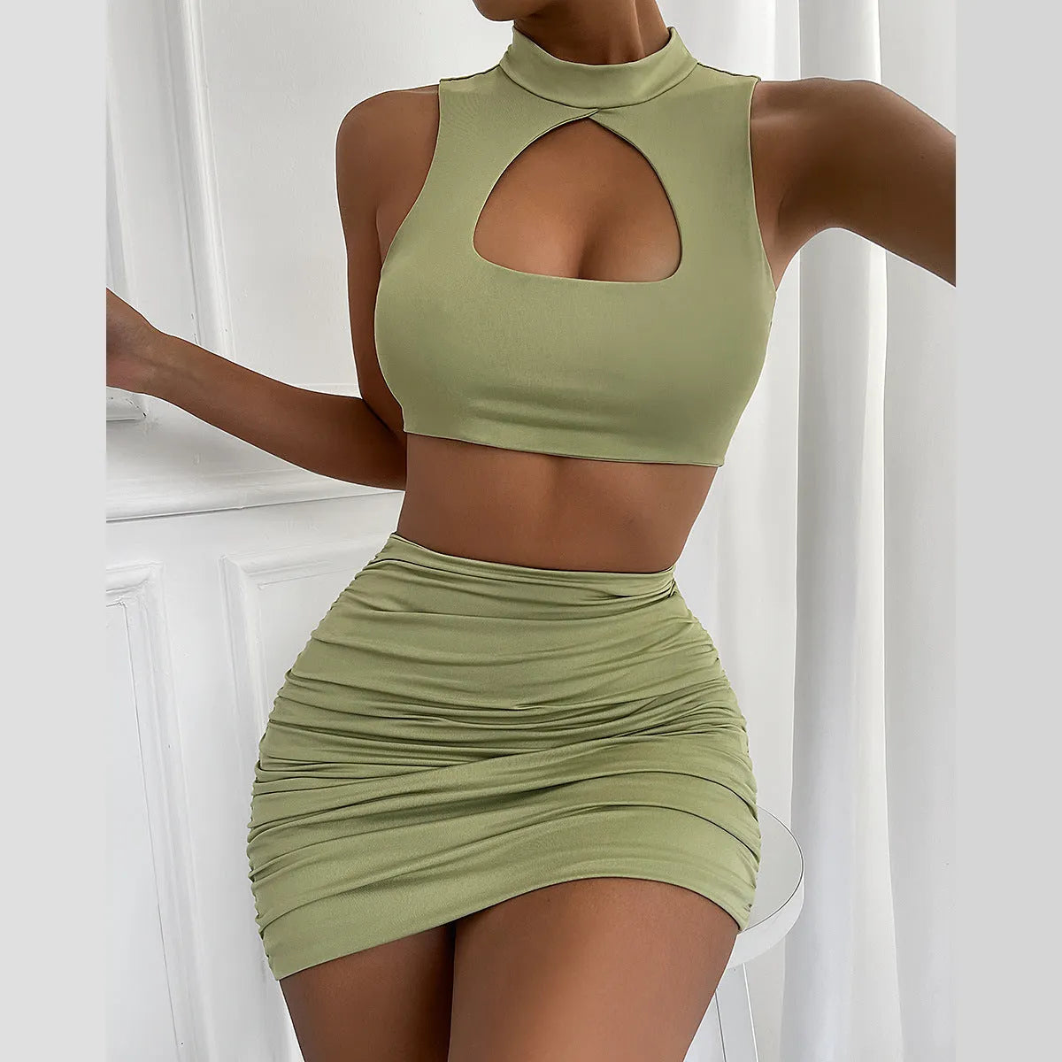 Light purple two-piece set with hollow vest top and hip skirt in elastic polyester fabric