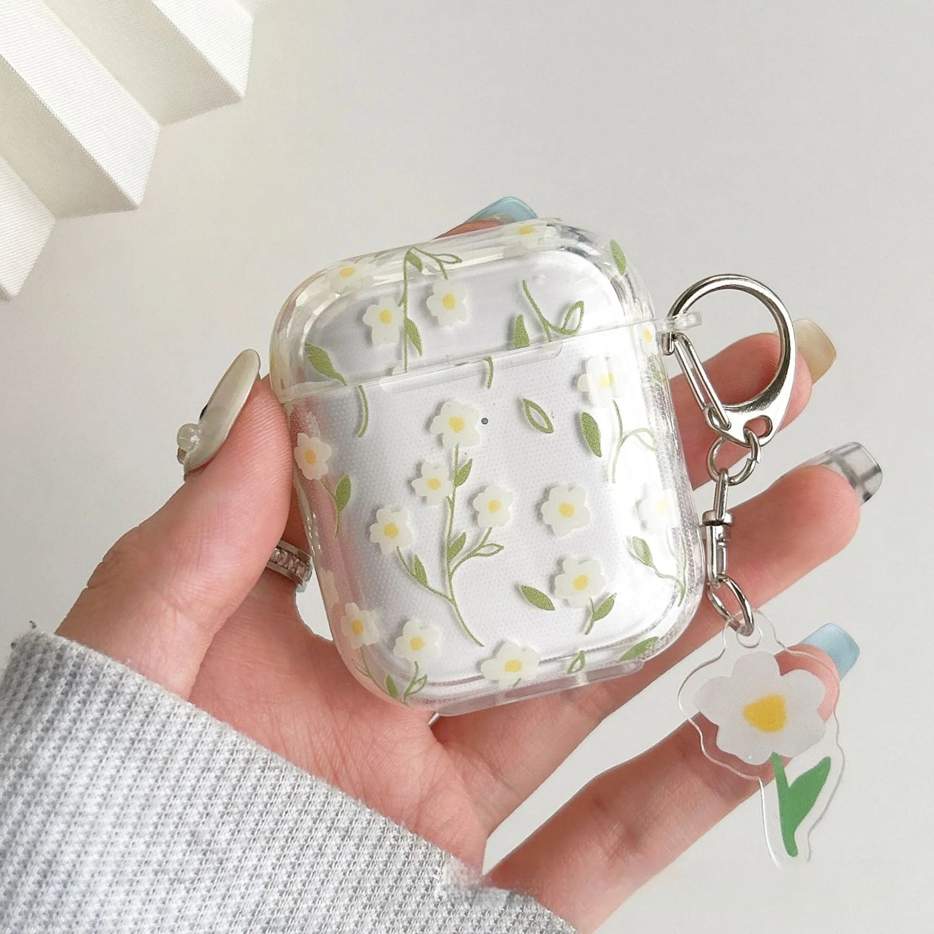 White floral pattern on a transparent TPU protective case for Apple AirPods