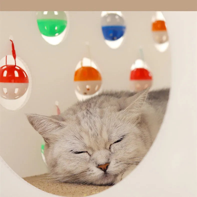 Integrated cat scratch board and nest toy with bell ball and tunnel features
