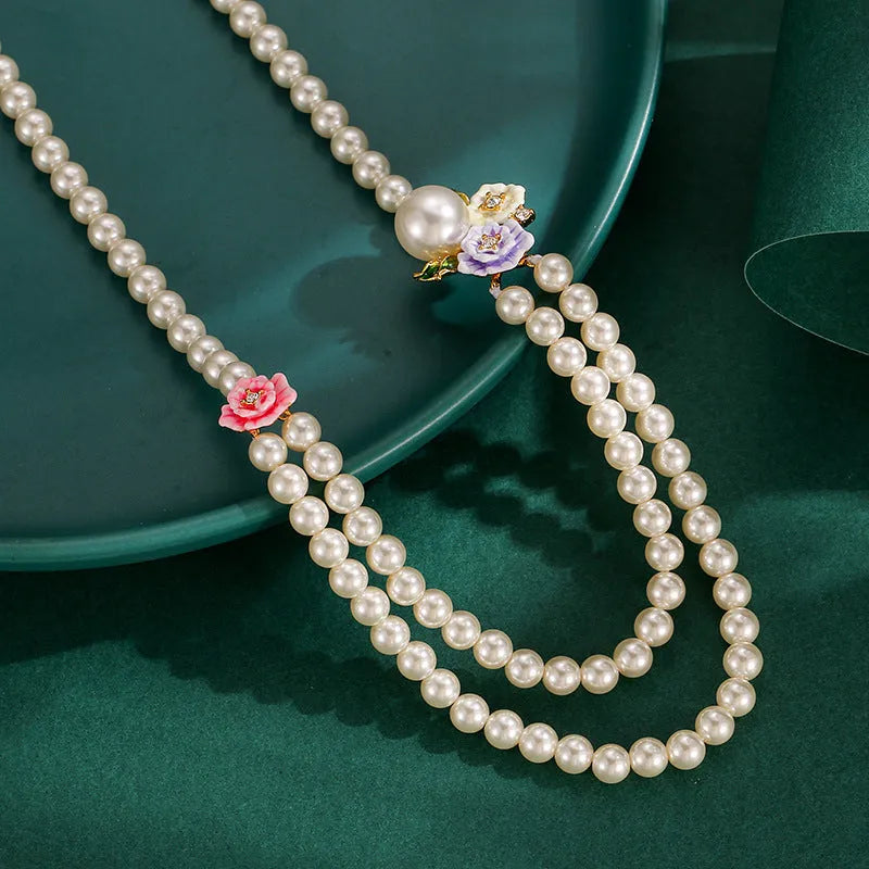 Enamel glaze diamond three-colour rose double-layer pearl necklace for women on display