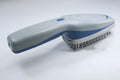 White electronic pet comb with negative ion and active oxygen technology, removable brush head, and 78 teeth.