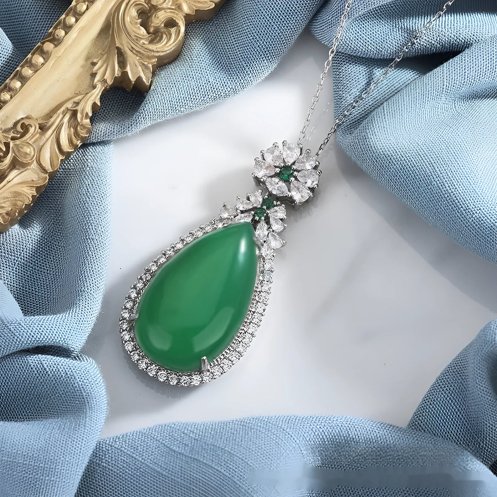 Green chalcedony water drop pendant with inlaid stone and electroplated copper geometric ellipse setting