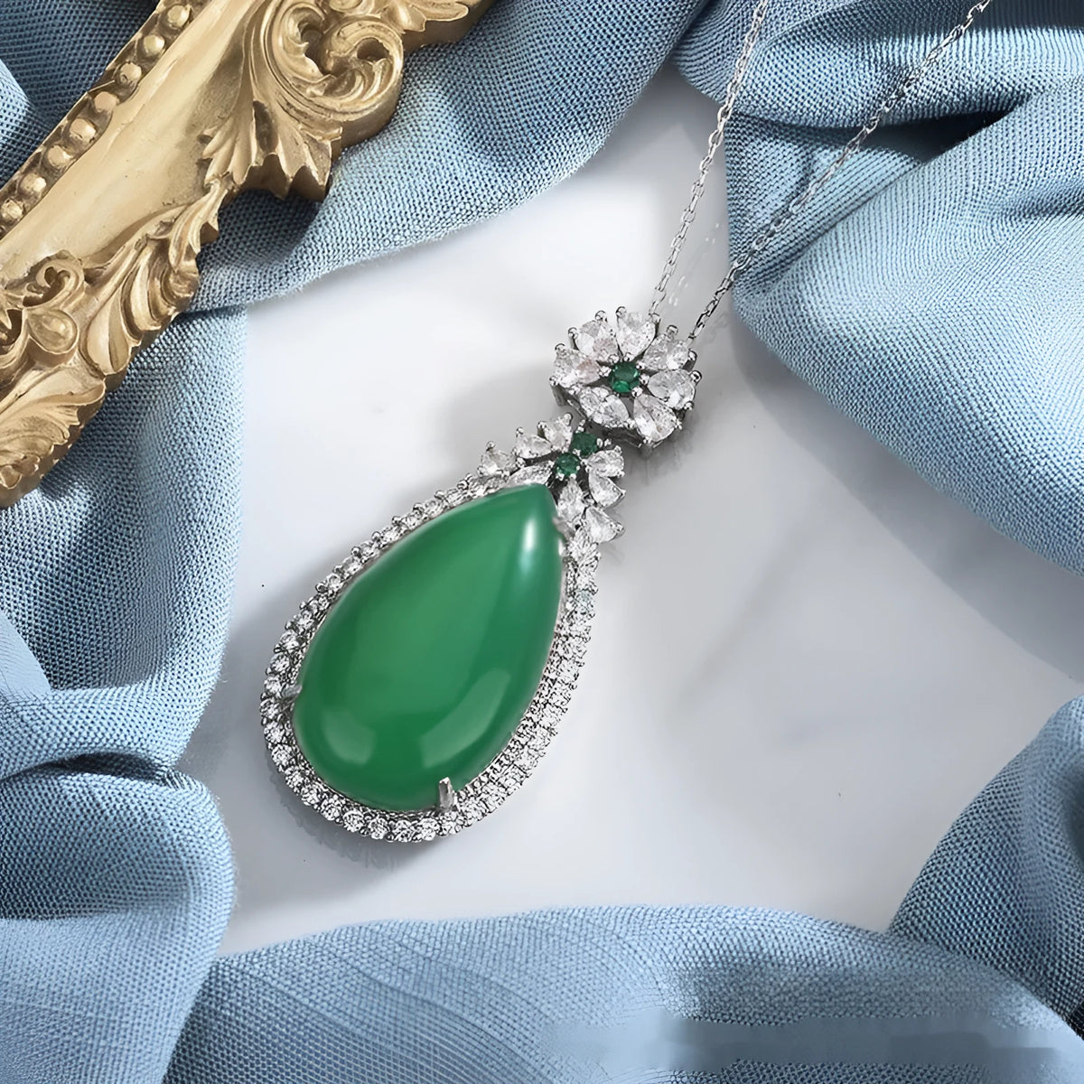 Green chalcedony water drop pendant with inlaid stone and electroplated copper geometric ellipse setting