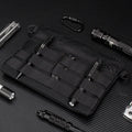 Black multifunctional outdoor kit made of Oxford cloth, measuring 18cm x 3.5cm, designed for military and camping use.