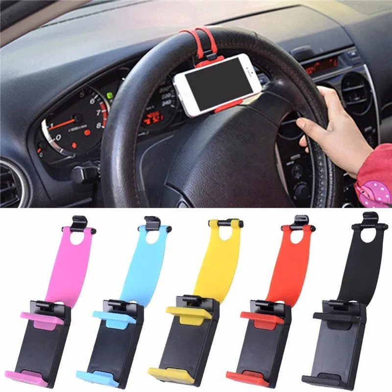 Black steering wheel phone mount holder clipped to a car wheel, holding a large smartphone.