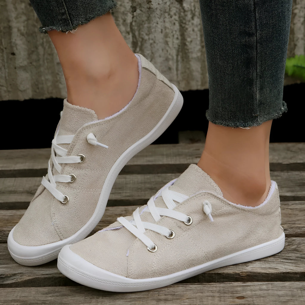 Women's creamy white casual sneakers with fabric upper and rubber sole