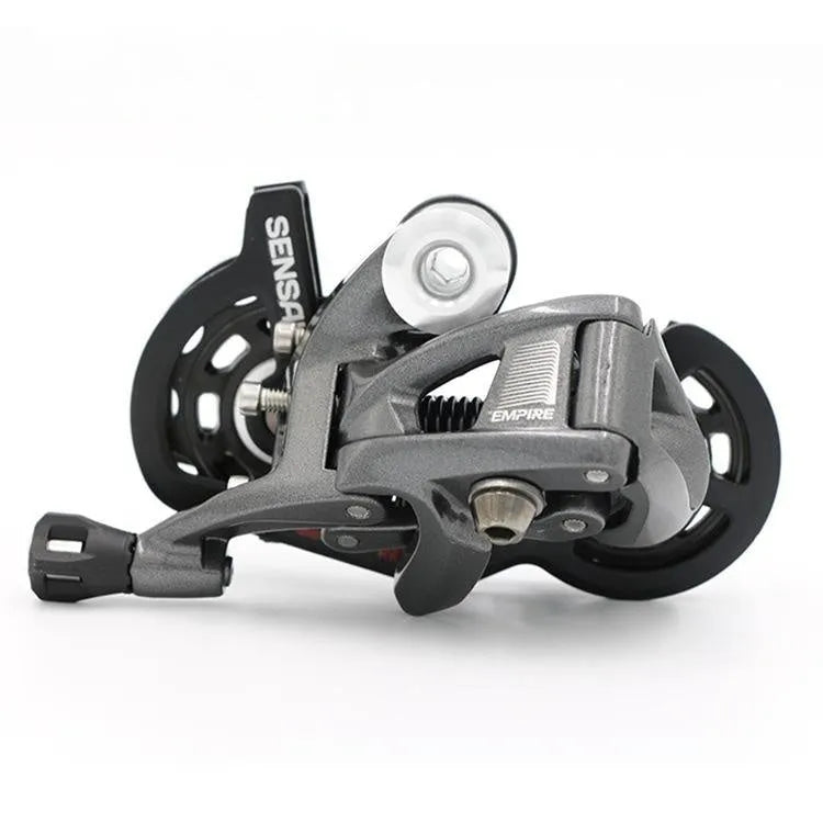 Road bike transmission kit with aluminium manual shift lever, front dial, and short leg rear derailleur.