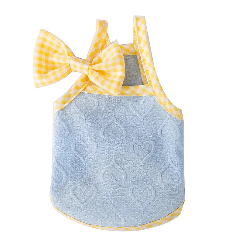 Small dog wearing heart bow suspenders vest with elastic sides in Bondi Blue colour with matching hairband